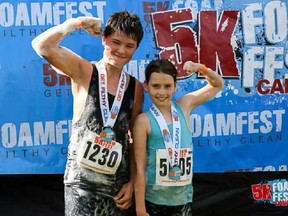 Taylor Kelly poses with her cousin, Griffin Mason, at the FoamFest run.