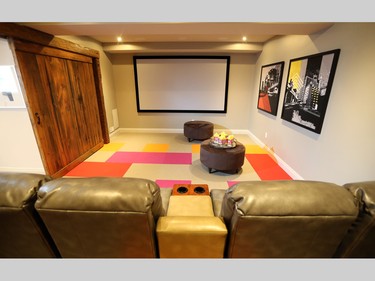 In the basement, a star attraction is the home theatre, complete with theatre seating and a stunning sliding barn door to close out light and sound.