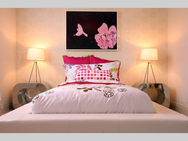 The other girl’s room, aimed at a younger daughter, has echoes of big sister’s room, including chrome night stands and splashes of colour, this time fuchsia. Of note: Almost all of the rooms in the house have a hit of black and white to give them a pop of energy.