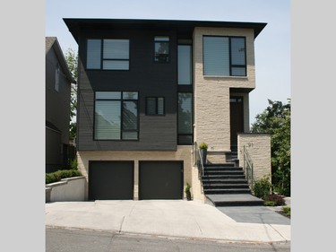 This modern home was custom built to fit on a narrow lot in Kitchissippi Ward. Its design revolves around a two-storey, light-filled raised garden courtyard, which provides a lush visual focus to the living spaces. It features 10-foot ceilings, floor-to-ceiling windows and an open interior flooded by natural light.