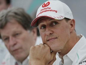 FILE - In this Thursday, Oct. 4, 2012 file photo, former Mercedes F1 driver Michael Schumacher of Germany pauses during a news conference to announce his retirement from Formula One at the end of  2012  in Suzuka, Japan.  Former Formula One world champion Michael Schumacher has left hospital to continue his recovery at home, his manager said Tuesday. The seven-time champion suffered a serious head injury while skiing in France in December, resulting in him being put in a coma.