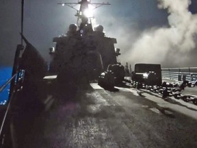 In this image made from video released by the U.S. Navy on Tuesday, Sept. 23, 2014, missiles bound for Syrian Islamic State group targets are launched off of a U.S. Navy ship. U.S. officials said the airstrikes began around 8:30 p.m. EDT (0030 GMT) Monday, and were conducted by the U.S., Bahrain, Qatar, Saudi Arabia, Jordan and the United Arab Emirates. (AP Photo/U.S. Navy via AP video)
