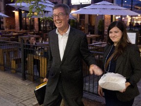 Mayor Jim Watson and campaign manager Danielle McGee leave Tuesday evening's fundraiser for the mayor's re-election hosted by Neil Malhotra of Claridge and Ted Phillips of Taggart Realty.