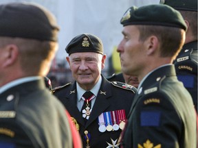 Governor General David Johnston inspects soldiers during a Sunset ceremony celebrating the 100th anniversary of the Patricia's Canadian Light Infantry and the Royal 22nd Regiment on Parliament Hill on Friday, September 19, 2014.