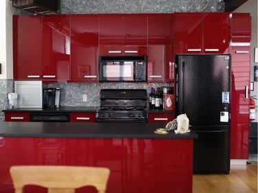 Sleek red cabinets add pop to a modern infill on Gordon Street with an industrial theme, one of five homes on the tour.
