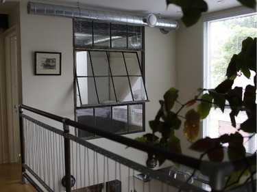 A mezzanine offers a long view of the west-facing windows.