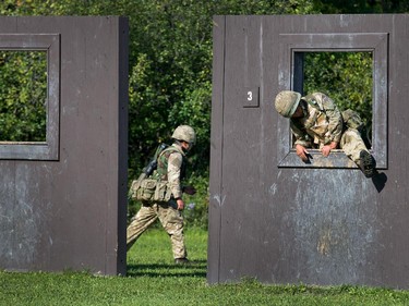 A British soldier goes through a window on the obstacle course as the annual Canadian Armed Forces Small Arms Concentration (CAFSAC) was held at the Connaught Ranges and Primary Training Centre near Shirley's Bay.