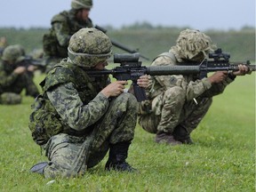 A Canadian soldier fires his rifle during the finals of the Canadian Armed Forces Small Arms Concentration (CAFSAC) at Connaught Range on Saturday.