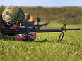 A Canadian soldier looks down the sights as his weapon ejects a casing while shooting on the 500 metre firing line as the annual Canadian Armed Forces Small Arms Concentration (CAFSAC) was held at the Connaught Ranges and Primary Training Centre near Shirley's Bay.