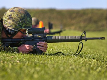 A Canadian soldier looks down the sights as his weapon ejects a casing while shooting on the 500 metre firing line as the annual Canadian Armed Forces Small Arms Concentration (CAFSAC) was held at the Connaught Ranges and Primary Training Centre near Shirley's Bay.