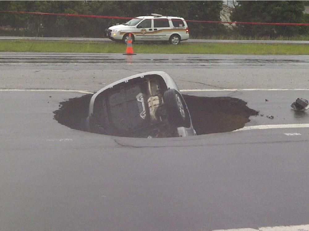 Sinkhole ‪ Highway 174 sinkhole driver sues city for more than half