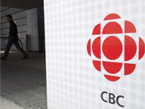 A man leaves the CBC building in Toronto, April 4, 2012.