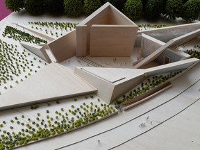 A model of the winning design for the National Holocaust Monument is displayed during an announcement at the National War Museum in Ottawa on Monday, May 12, 2014. The monument design by Team Lord of Toronto is titled "Landscape of Loss, Memory and Survival." It will be built beside the War Museum in downtown Ottawa.
