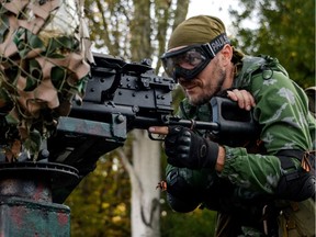 A Pro-Russian rebel prepares arms for the the assault on the positions of Ukrainian army in Donetsk airport, eastern Ukraine, Sunday, Aug. 31, 2014. Russian President Vladimir Putin on Sunday called on Ukraine to immediately start talks on a political solution to the crisis in eastern Ukraine. Hours later, Ukraine said a border guard vessel operating in the Azov Sea was attacked by land-based forces.