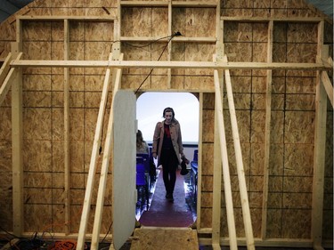 A woman walks through Genevieve Thauvette's flight simulator installation that gives participants an uneasy feeling of flying, under the Plaza Bridge during Nuit Blanche in Ottawa, on Saturday, September 20, 2014. (