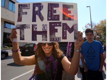 A young lady participates in Freedom Walk in downtown Ottawa, Saturday, September 27, 2014. Anti-human trafficking organizations are celebrating their fifth annual walk, but first in Ottawa. They raise funds and hope to increase awareness to fight human trafficking, a growing problem in Canada (and around the world).