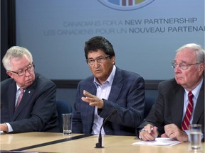 From left, former Prime Ministers Joe Clark and Paul Martin look on as former Assembly of First Nations Chief Ovide Mercredi (centre) responds to questions during a news conference in Ottawa on Thursday, September 4, 2014.