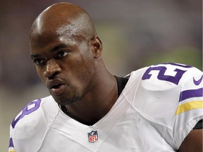 FILE - In this Sept. 7, 2014, file photo, Minnesota Vikings running back Adrian Peterson warms up for an NFL football game against the St. Louis Rams in St. Louis. The Vikings benched Peterson for Sunday's game after his attorney said he had been indicted by a Texas grand jury on a charge of child abuse. Attorney Rusty Hardin says the charge accuses Peterson of using a branch, or switch, to spank his son. He says Peterson has cooperated with authorities and "used his judgment as a parent to discipline his son." Hardin says Peterson regrets the incident but never intended to harm the boy.