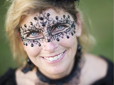 Barb Buchanan shows offer her face paint at the 2014 Harvest Noir picnic, Sept. 27, 2014.