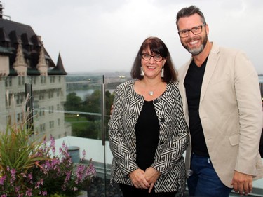 Caterer Sheila Whyte from Thyme & Again and interior designer Ernst Hupel step out onto Zita Cobb's terrace at 700 Sussex Drive during a reception held in support of Hospice Care Ottawa on Wednesday, Sept. 17, 2014.