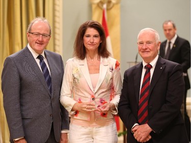 Charlene Larose, receives on behalf of her team, the 2014 Public Service Award of Excellence 2014 for Employee Innovation. The Public Service of Canada commends this multidisciplinary team for its compassion in developing and implementing a client-focused process to deliver ex gratia payments to the families of victims who perished in the bombing of Air India Flight 182. In a spirit of cross-government collaboration, and in close consultation with the bereaved families, the team found fair and effective solutions that fully met the Government's commitment to those affected by this terrible tragedy. The team's sensitive and responsive approach represents Canada's public service at its very best, and offers a concrete example of what it means to serve Canadians.
