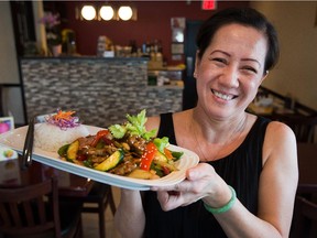 Chef Phuong Côté of Asian Stars Restaurant on Clyde Avenue shows off one of her vegan dishes, Kung Pao Mock Chicken. (Wayne Cuddington/Ottawa Citizen)