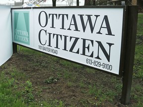 The new Ottawa Citizen signage is installed at the Baxter Road location Friday, May 16, 2014.