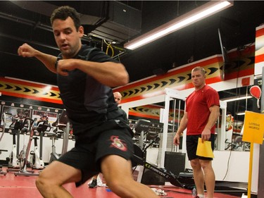 Clarke MacArthur does the "lateral shuffle" with Chris Neil looking on as the Ottawa Senators are given medicals and tested for strength and conditioning.