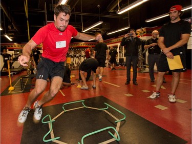 Cody Ceci does the lateral jumping as the Ottawa Senators are given medicals and tested for strength and conditioning.