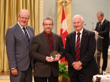 Denis Dufour, receives on behalf of his team, the 2014 Public Service Award of Excellence 2014 for Excellence in Policy. The Public Service of Canada recognizes this team for developing an effective consultation process with a First Nation community. The pilot project sought to apply the principles of genuine participation in the context of treaty negotiations with Regroupement Petapan Inc. The team members developed and maintained privileged links with the Nutashkuan First Nation, ensuring its full involvement in revising the management plan for the Mingan Archipelago National Park Reserve of Canada. This consultation process was successfully completed and now serves as a model for other land-management planning projects with First Nations across the country.