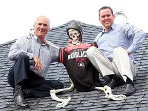 Dr. Robin Mallory, left and Dr. Bryan Watson pose with Mr. Bones, their rooftop mascot at the Carling Chiropractic & Sports Injury Clinic.