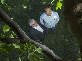 Ecology Ottawa's climate change lead, Charles Hodgson, left, and executive director, Graham Saul, right, are photographed in Major's Hill Park Thursday, September 25, 2014. They'll be keeping their eyes on the new Ottawa city council and what it does to address the environment and climate change. (Darren Brown/Ottawa Citizen)