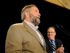 NDP leader Tom Mulcair addresses his caucus in Edmonton Wednesday.