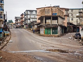 Empty streets are seen, as Sierra Leone government enforces a three day lock down on movement of all people in an attempt to fight the Ebola virus, in Freetown, Sierra Leone, Friday, Sept. 19, 2014. Thousands of health workers began knocking on doors across Sierra Leone on Friday in search of hidden Ebola cases with the entire West African nation locked down in their homes for three days in an unprecedented effort to combat the deadly disease.