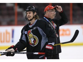 Erik Karlsson and Coach Paul MacLean as the Ottawa Senators practice at Canadian Tire Centre. Photo taken on April 11, 2014.