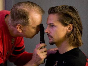 Erik Karlsson has his eyes examined as the Ottawa Senators are given medicals and tested for strength and conditioning.