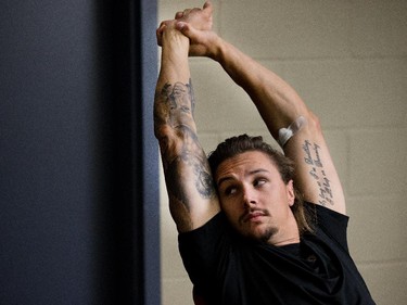 Erik Karlsson stretches while waiting for his eyes to be tested as the Ottawa Senators are given medicals and tested for strength and conditioning.