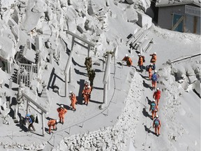 Firefighters advance to rescue climbers near the peak of Mount Ontake in central Japan, Sunday, Sept. 28, 2014.