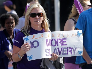 Freedom Walk participant outside Convention Centre in downtown Ottawa, Saturday, September 27, 2014. Anti-human trafficking organizations are celebrating their fifth annual Freedom Walk, but first in Ottawa. They raise funds and hope to increase awareness to fight human trafficking, a growing problem in Canada (and around the world). Mike Carroccetto / Ottawa Citizen