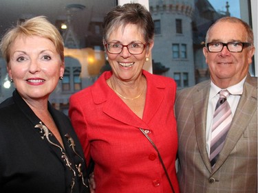 From left, event chair Gail Joynt with Jane Panet and Jim Taggart, honorary chairs of Hospice Care Ottawa's Homes for the Holidays 2014, at a fundraising reception held at the penthouse level of 700 Sussex Drive on Wednesday, Sept. 17, 2014.
