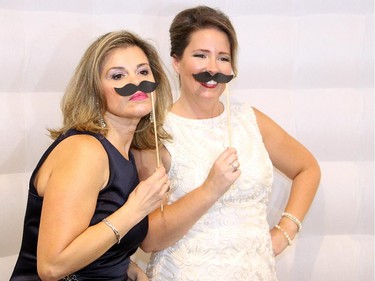 From left, Maria Pacheco and Heather Summers strike a fun pose at the Vibe Photo Booth during the 2nd annual circus-themed gala hosted by the University of Ottawa's Faculty of Medicine on Saturday, Sept. 27, 2014, at the Westin Hotel.