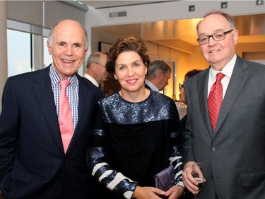 From left, Thomas d'Aquino, seen with Sue McNee and Rod Bell, was among the penthouse owners at 700 Sussex Drive to open up their condos for a Hospice Care Ottawa reception held Wednesday, Sept. 17, 2014.
