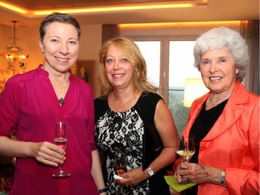 From left, Zita Cobb, seen with Lucie Guay and Lois Walker Gillin, was among the penthouse owners at 700 Sussex Drive to open up their condos for a Hospice Care of Ottawa reception, held Wednesday, Sept. 17, 2014.