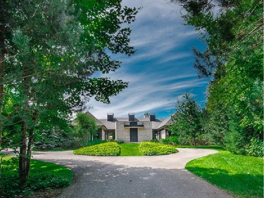 The home is a modified H plan with clean lines and a wing for visitors.