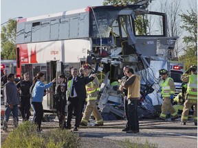The front of an OC Transpo bus is barely distinguishable after a horrific crash between the double decker bus and a Via train near the Fallowfield station in Barrhaven on Sept. 18, 2013.