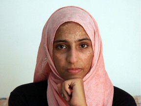 Syrian survivor Doaa Al Zamel talks to AFP on September 17, 2014 in an appartment at the port town of Chania on the southern Greek island of Crete. Doaa Al Zamel  is one of just 10 survivors of Europe's deadliest migrant shipwreck, caused when traffickers rammed a migrant vessel off Malta on September 10 and left some 500 people on board to drown. Of the 10 survivors, two Palestinians were taken to Italy, two to Malta, while the other six, including a two year-old Syrian girl, were taken to hospital in Crete.The five adults -- three Palestinian men, an Egyptian man and a Syrian woman -- have since been released. But the toddler remains in critical condition.