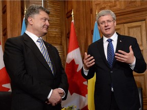 Prime Minister Stephen Harper meets with Ukraine President Petro Poroshenko at his office in Ottawa, Wednesday, Sept.17, 2014.