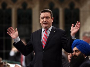 Paul Calandra stands during Question Period in the House of Commons in Ottawa, Friday, May 3, 2013.