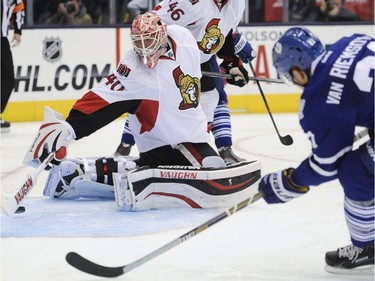 Toronto Maple Leafs forward James van Riemsdyk, right, scores on Ottawa Senators goalie Robin Lehner during third period NHL pre-season action in Toronto on Wednesday, Sept. 24, 2014.