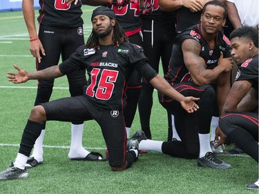 Jamill Smith, left, hams it up as the Ottawa Redblacks had their official team photos taken at TD Place.